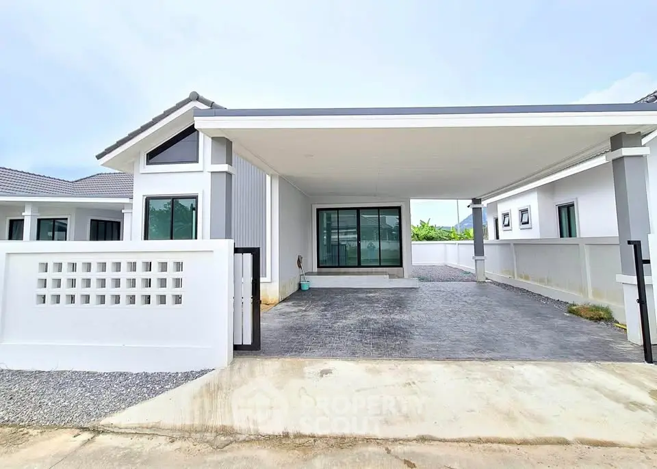 Modern single-story house with carport and sleek exterior design