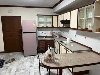 Spacious kitchen with modern appliances and ample counter space in a stylish home.