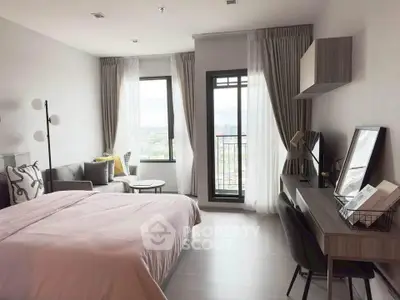 Modern bedroom with city view, stylish decor, and natural light