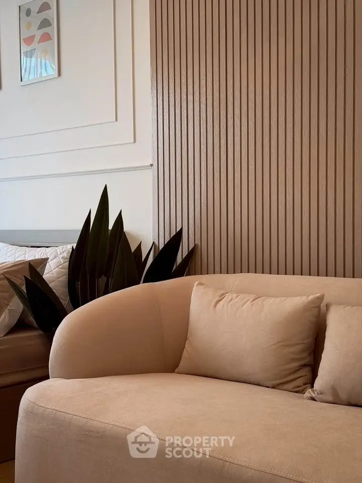 Stylish modern living room with beige sofa and decorative wall panels