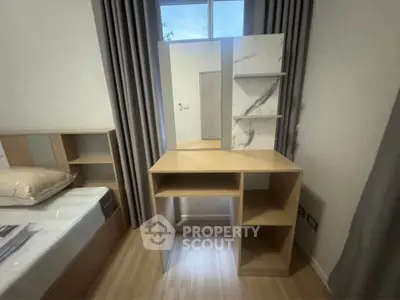 Modern bedroom with stylish wooden furniture and elegant curtains