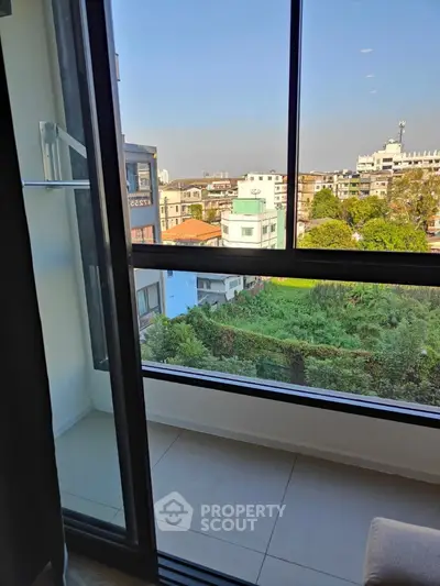 Spacious balcony with stunning city view in modern apartment