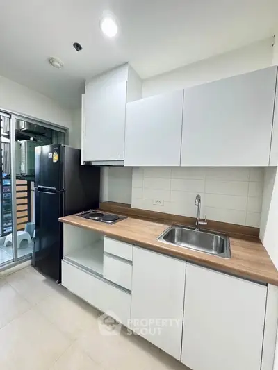 Modern kitchen with sleek cabinetry and stainless steel appliances