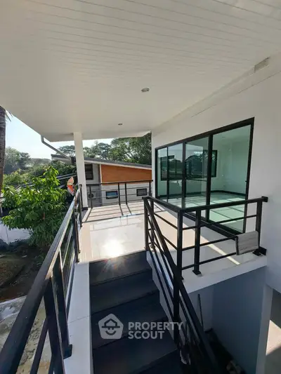 Modern balcony with sleek railing and scenic view in contemporary home