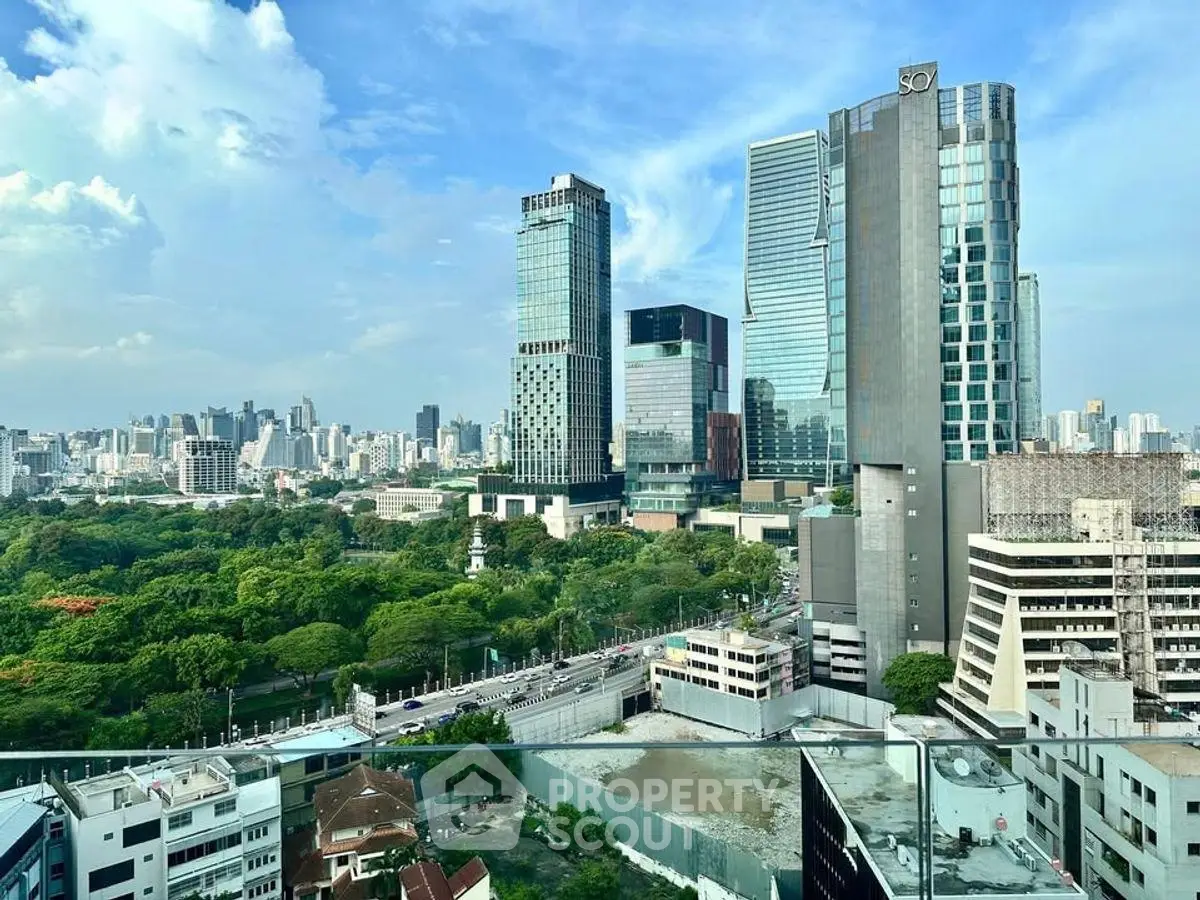 Stunning cityscape view with modern skyscrapers and lush greenery, perfect for urban living.