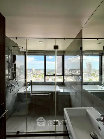 Luxurious bathroom with stunning city view and modern glass shower enclosure.