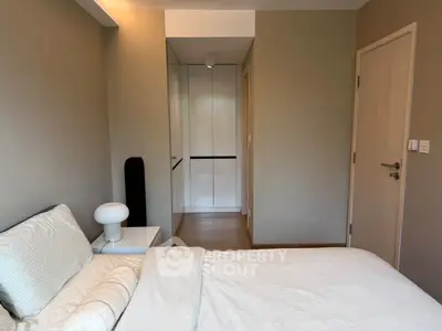 Cozy bedroom with modern decor and ample storage space