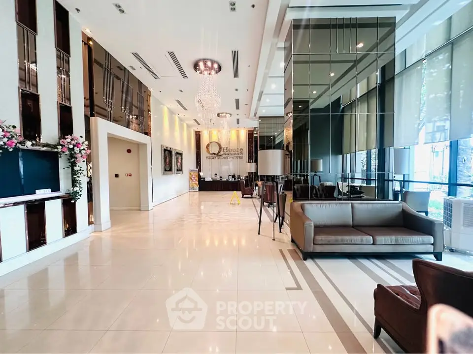 Luxurious lobby with elegant decor and modern seating in a high-end residential building.