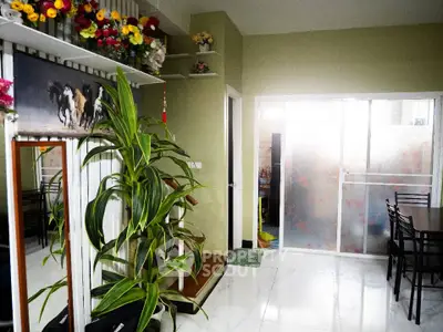 Charming interior with vibrant decor and sliding glass doors, perfect for modern living.