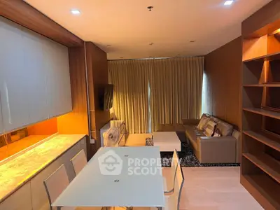 Modern living room with elegant dining area and cozy seating, perfect for relaxation and entertainment.