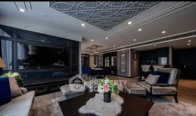Luxurious living room with elegant decor and spacious layout, featuring modern furniture and stylish ceiling design.