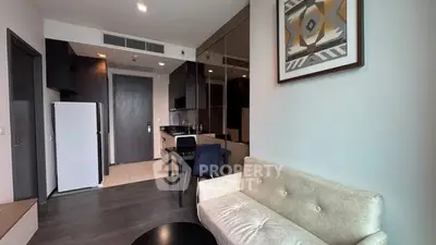 Modern apartment interior with stylish decor and compact kitchen area.