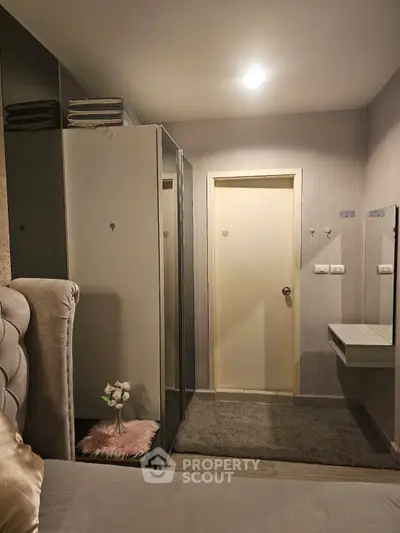 Cozy bedroom with modern decor and ample storage space