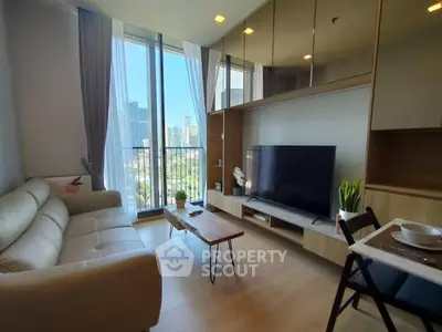 Modern living room with city view, sleek furniture, and large TV