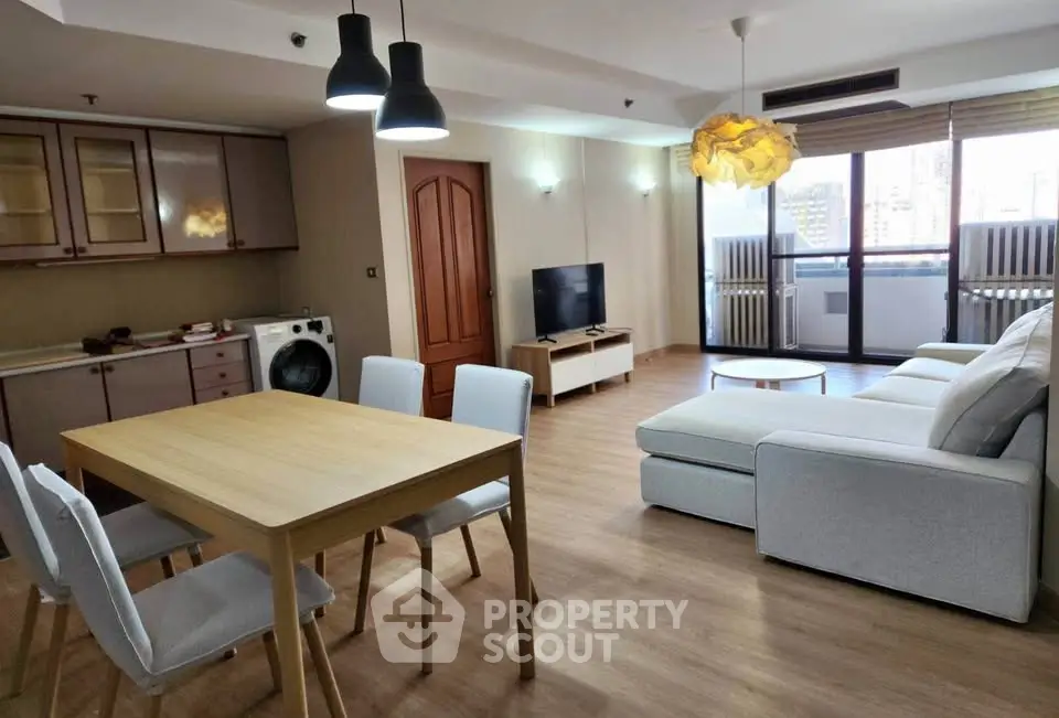 Spacious modern living room with open kitchen and stylish furniture