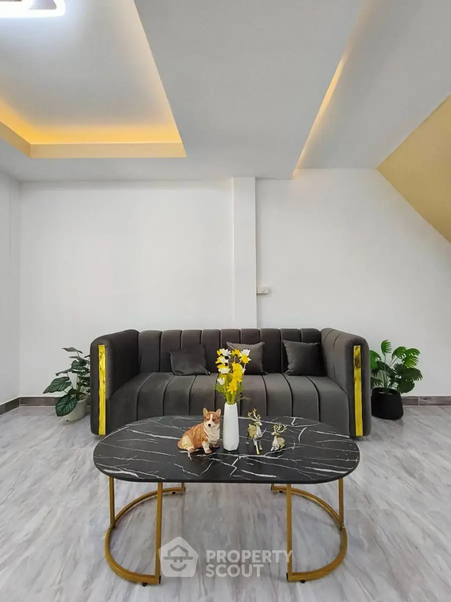 Modern living room with stylish sofa and marble coffee table