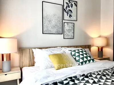 Cozy bedroom with stylish decor and modern lighting