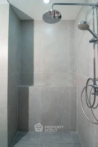 Modern bathroom shower with sleek tile design and rainfall showerhead