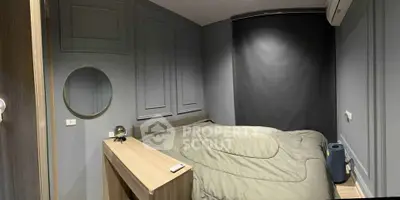 Cozy modern bedroom with sleek gray walls and minimalist decor