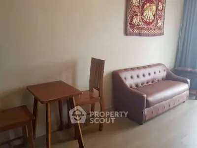 Cozy living room with wooden furniture and elegant wall art