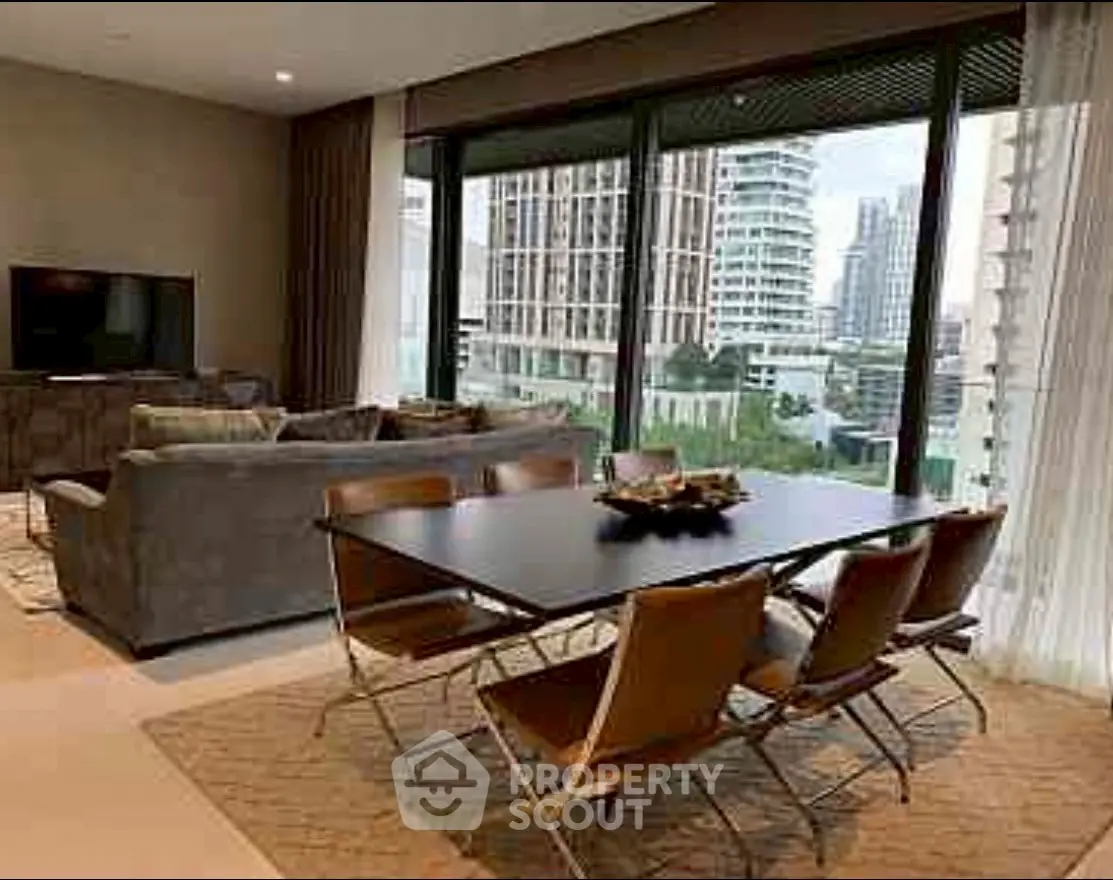 Luxurious living room with modern dining area and stunning city view