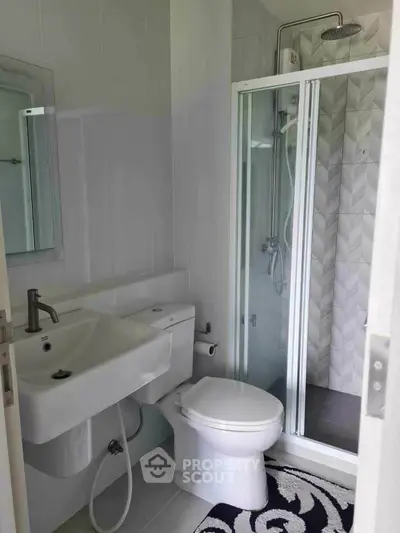 Modern bathroom with shower enclosure and sleek fixtures