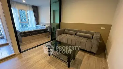 Modern apartment with glass partitioned bedroom and cozy living area