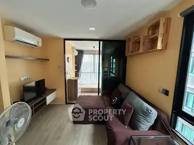 Modern living room with cozy sofa and large window view