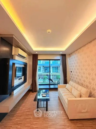 Modern living room with elegant lighting and balcony view in a stylish apartment.