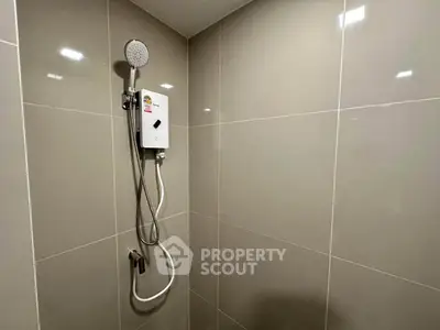 Modern bathroom with sleek shower design and neutral tiles