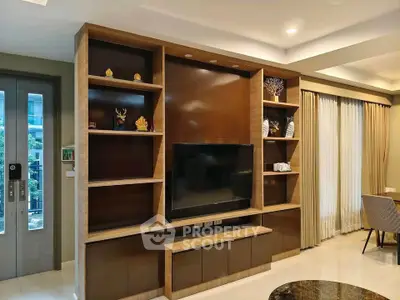 Modern living room with elegant wooden TV unit and stylish decor