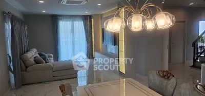 Luxurious living room with elegant chandelier and modern decor