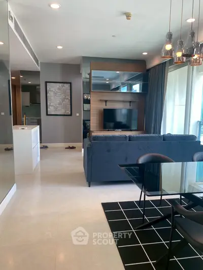 Modern living room with sleek furniture and stylish decor in a contemporary apartment.