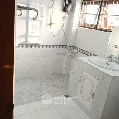 Spacious bathroom with modern fixtures and natural light