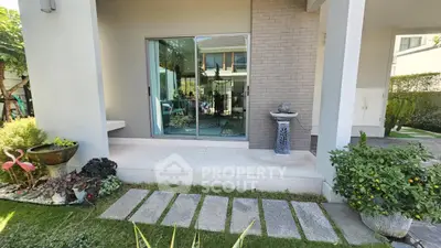 Charming garden view with modern patio and lush greenery