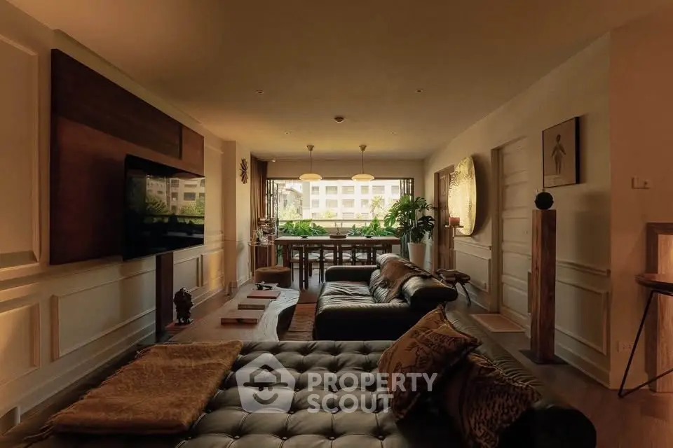 Luxurious living room with elegant decor and large windows offering a stunning view.