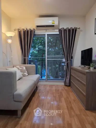Cozy living room with modern decor and balcony view