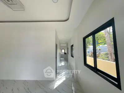 Bright hallway with modern design and large windows in a contemporary home