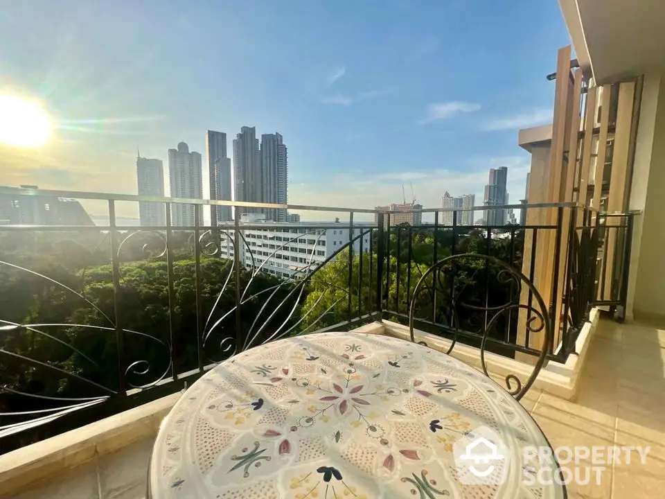 Stunning balcony view with city skyline and lush greenery, perfect for relaxation and urban living.