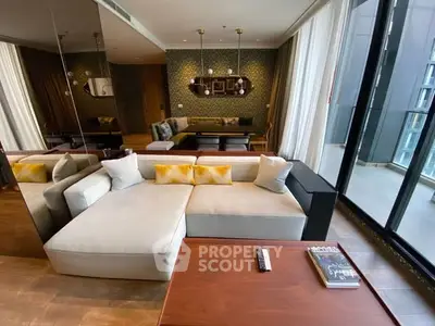 Luxurious living room with modern decor and large windows offering stunning views.