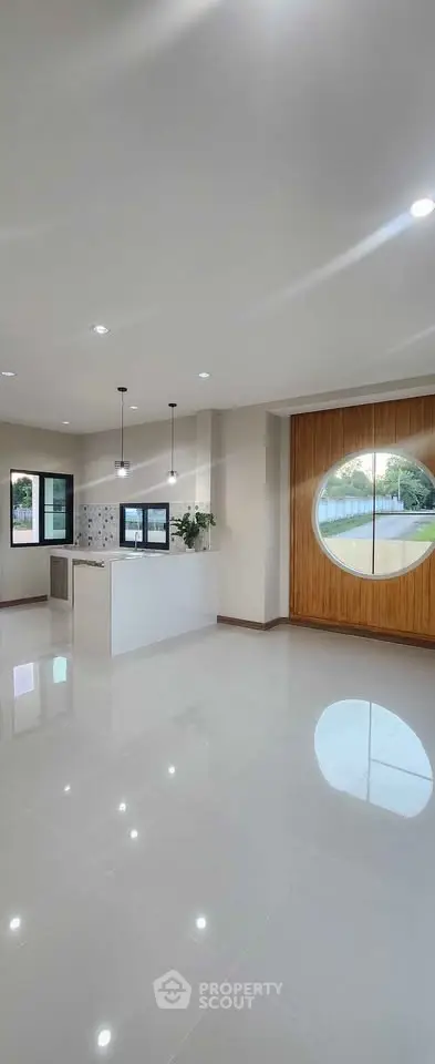 Spacious modern living room with large windows and sleek design
