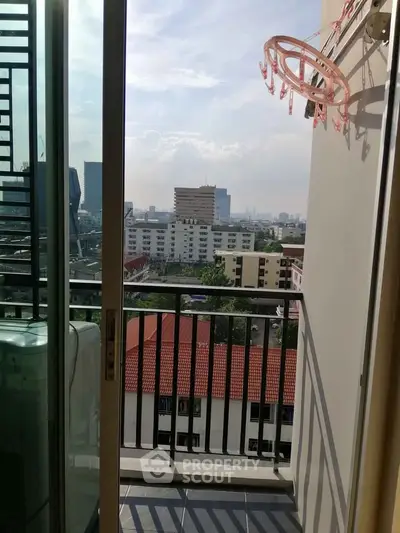 Charming balcony with city view, perfect for relaxation and enjoying urban skyline.