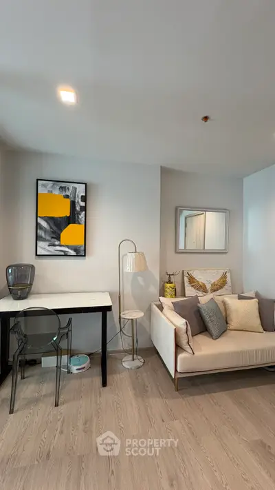Modern living room with stylish decor and cozy seating area, perfect for relaxation and entertaining.