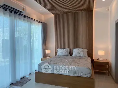 Modern bedroom with elegant decor and large window view
