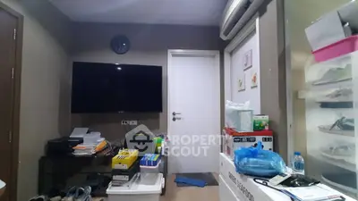 Cozy living room with wall-mounted TV and storage solutions