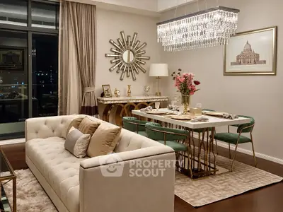 Luxurious living and dining area with elegant chandelier and stylish decor
