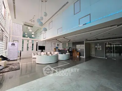 Luxurious modern building entrance with sleek design and ample natural light