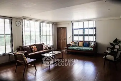 Spacious living room with stylish furniture and large windows for natural light.