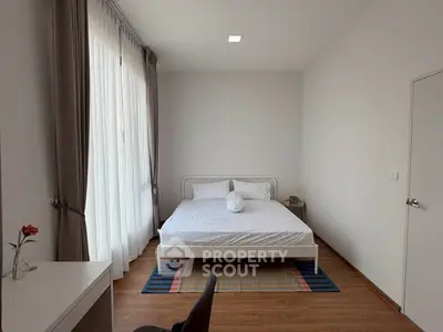 Modern minimalist bedroom with natural light and stylish decor