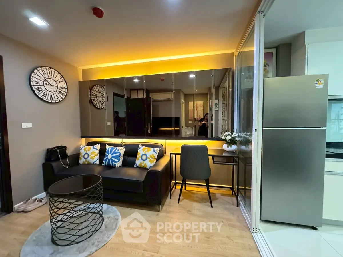 Modern living room with stylish decor and open kitchen layout